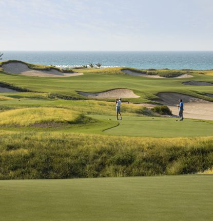 Two Golfers at Saadiyat Beach Golf Club in Abu Dhabi