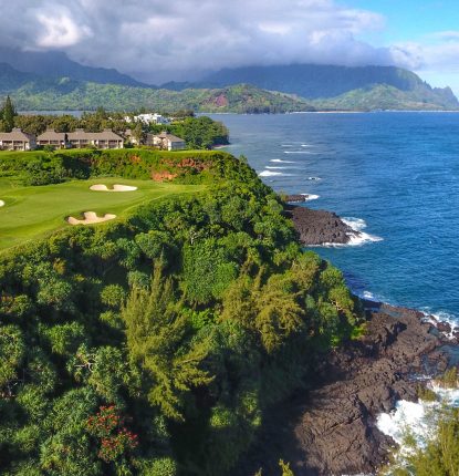 aerial shot of hole 7 of princeville makai, features of water and trees