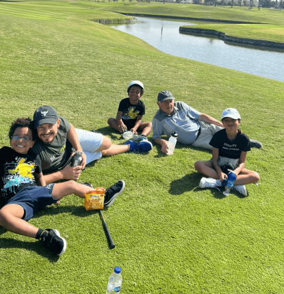 Clintont Norris and family on the Par 3 Golf Course at Montgomerie Golf Club Dubai