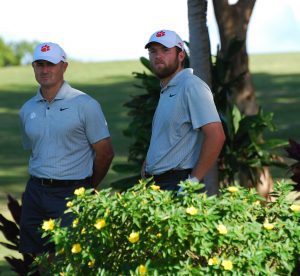 Clemson head coach Jordan Byrd and tournament co-leader Andrew Swanson on No. 15 tee