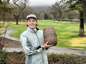 Garrett Boe holds the trophy of the Grapevine Amateur