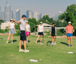 Ladies during a golf lesson with Scott at Montgomerie golf club dubai