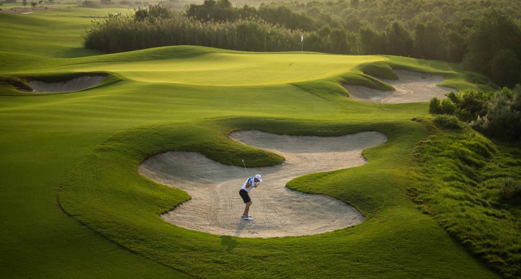 Golfer in the bunker at Al Zorah Golf Club