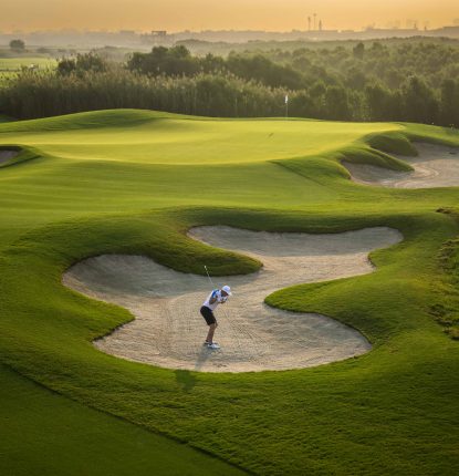 Golfer in the bunker at Al Zorah Golf Club